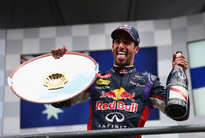 Daniel Ricciardo of Australia and Infiniti Red Bull Racing celebrates on the podium after winning the Belgian Grand Prix at Circuit de Spa-Francorchamps on August 24, 2014 in Spa, Belgium. 