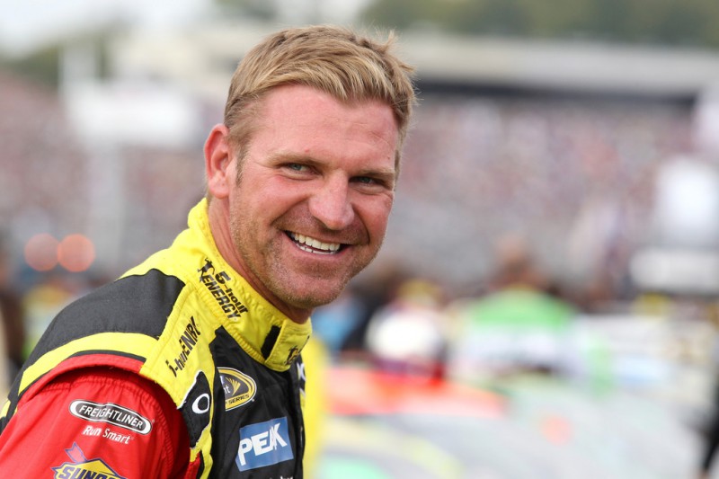 Clint Bowyer, driver of the #15 5-hour Energy Toyota, stands on the grid during the NASCAR Sprint Cup Series Sylvania 300 at New Hampshire Motor Speedway on September 21, 2014 in Loudon, New Hampshire. 