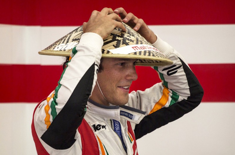 Mahindra driver Brune Senna of Brazil wears a traditional Chinese village hat in the pits before the inaugral FIA Formula E Beijing ePrix Championship race on September 13, 2014 in Beijing, China. The electric car racing series is backed by many of the major sponsors of the main Formula One circuit, and is set to be hosted in nine other cities worldwide.