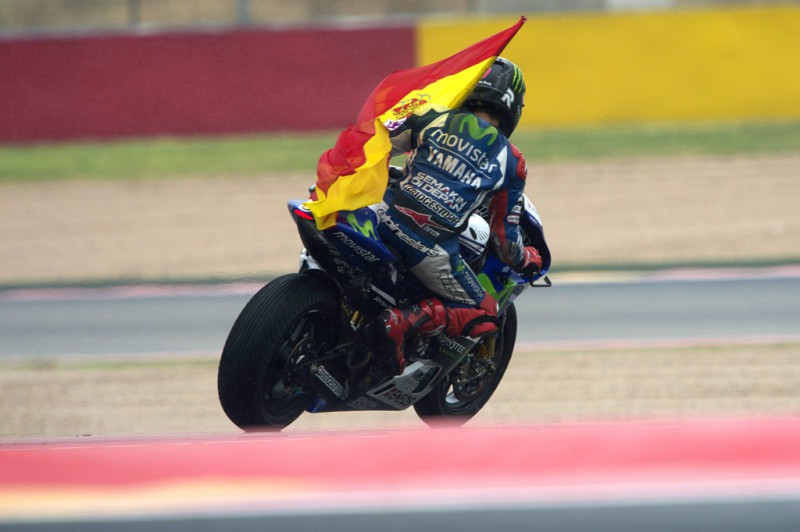 Jorge Lorenzo of Spain and Movistar Yamaha MotoGP celebrates with the flag of Spain after winning the MotoGP of Spain at Motorland Aragon Circuit on September 28, 2014 in Alcaniz, Spain. 