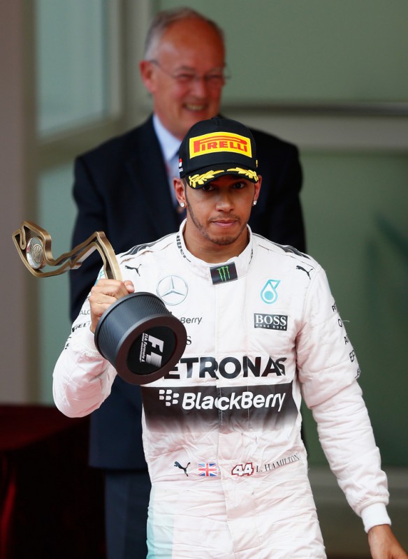 Lewis Hamilton of Great Britain and Mercedes GP reacts on the podium after finishing third during the Monaco Formula One Grand Prix at Circuit de Monaco on May 24, 2015 in Monte-Carlo, Monaco.
