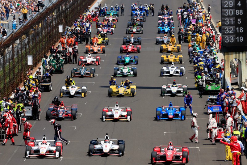 The cars roll off the grid just ahead of the 99th running of the Indianapolis 500 at Indianapolis Motorspeedway on May 23, 2015 in Indianapolis, Indiana. 