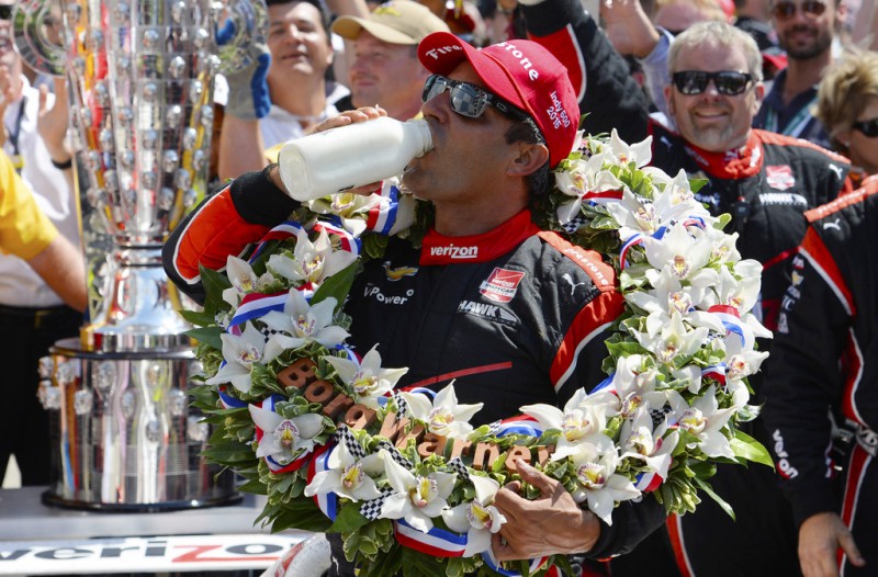 Juan Pablo Montoya of Colombia driver of the #2 Team Penske Chevrolet Dallara celebrates after winning the 99th running of the Indianapolis 500 mile race by drinking milk at the Indianapolis Motor Speedway on May 24, 2015 in Indianapolis, Indiana.