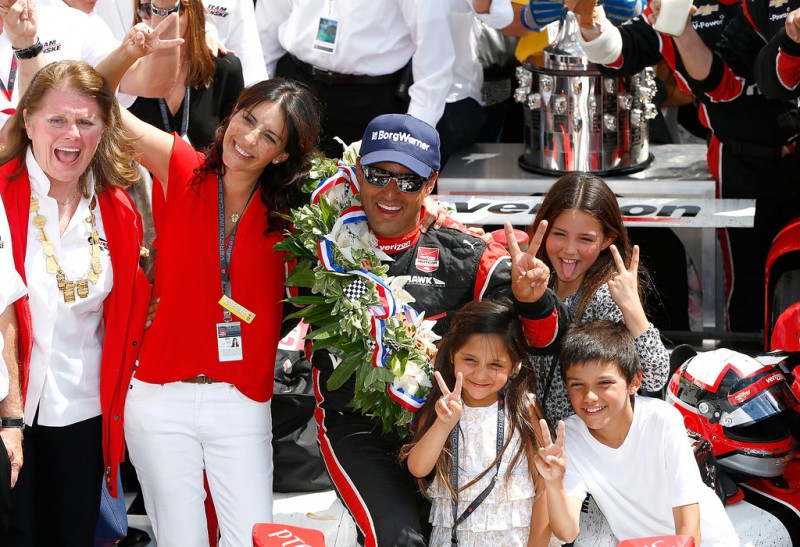 Juan-Pablo Montoya of Columbia, driver of the #2 Verizon Team Penske Chevrolet Dallara celebrates with his family in victory lane after winning the 99th running of the Indianapolis 500 Mile Race at Indianapolis Motorspeedway on May 24, 2015 in Indianapolis, Indiana.