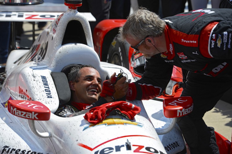 Juan Pablo Montoya of Colombia driver of the #2 Team Penske Chevrolet Dallara celebrates with a teammate after winning the 99th running of the Indianapolis 500 mile race at the Indianapolis Motor Speedway on May 24, 2015 in Indianapolis, Indiana.