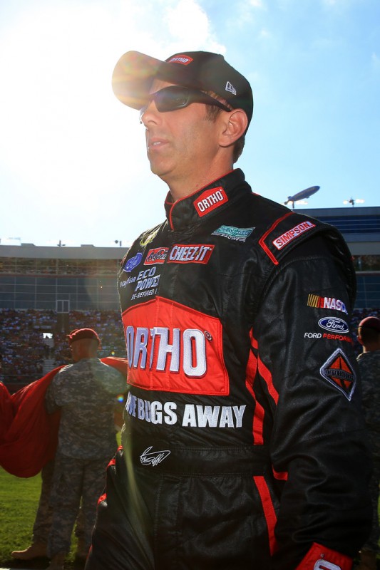 Greg Biffle, driver of the #16 Ortho Ford, walks on the grid prior to the NASCAR Sprint Cup Series Coca-Cola 600 at Charlotte Motor Speedway on May 24, 2015 in Charlotte, North Carolina. 