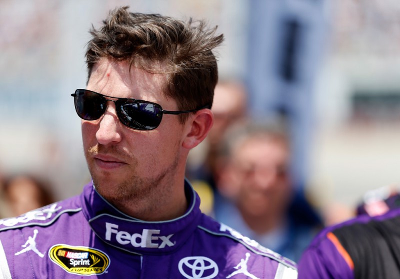 Denny Hamlin, driver of the #11 FedEx Cares Toyota, takes part in pre-race ceremonies for the NASCAR Sprint Cup Series FedEx 400 Benefiting Autism Speaks at Dover International Speedway on May 31, 2015 in Dover, Delaware. 
