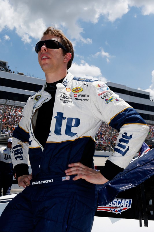 Brad Keselowski, driver of the #2 Miller Lite Ford, looks on from the grid during pre-race ceremonies for the NASCAR Sprint Cup Series FedEx 400 Benefiting Autism Speaks at Dover International Speedway on May 31, 2015 in Dover, Delaware.