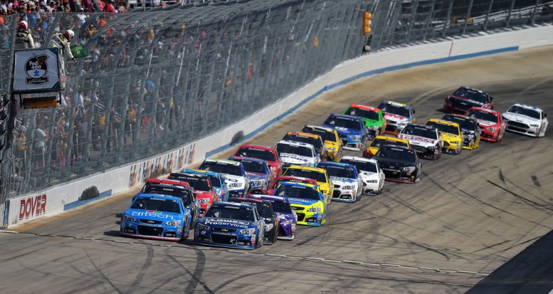 Jimmie Johnson, driver of the #48 Lowe's Pro Services Chevrolet, and Kevin Harvick, driver of the #4 ditech Chevrolet, lead the field to a restart during the NASCAR Sprint Cup Series FedEx 400 Benefiting Autism Speaks at Dover International Speedway on May 31, 2015 in Dover, Delaware. 