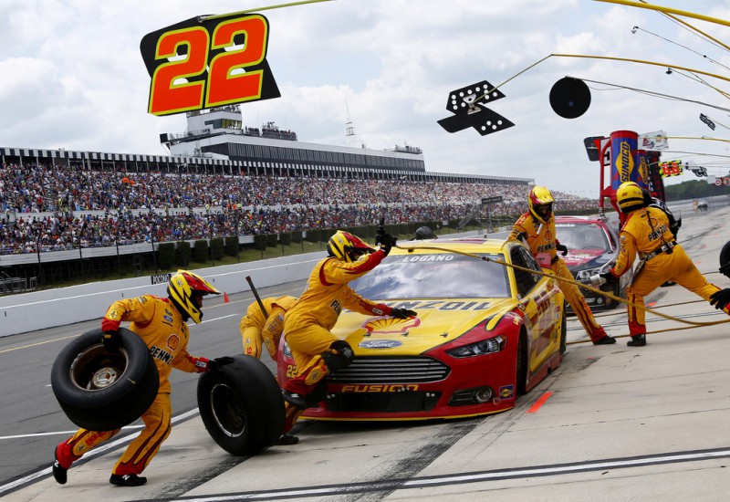 Joey Logano, driver of the #22 Shell Pennzoil Ford, pits during the NASCAR Sprint Cup Series Axalta 'We Paint Winners' 400 at Pocono Raceway on June 7, 2015 in Long Pond, Pennsylvania. 
