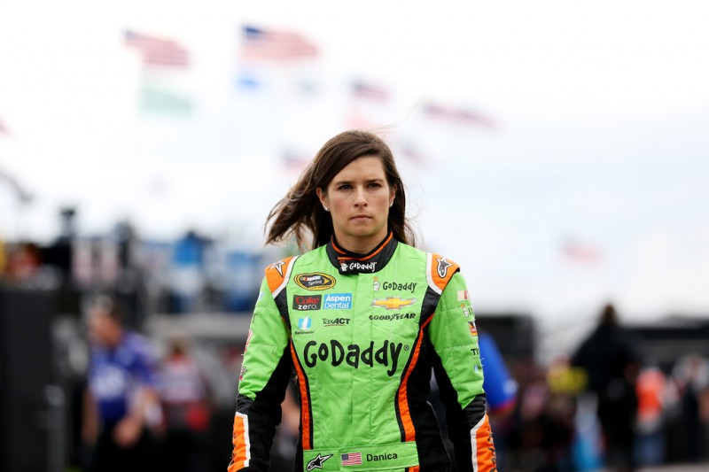 Danica Patrick, driver of the #10 GoDaddy Chevrolet, walks through the garage area during practice for the NASCAR Sprint Cup Series Axalta 'We Paint Winners' 400 at Pocono Raceway on June 6, 2015 in Long Pond, Pennsylvania. 