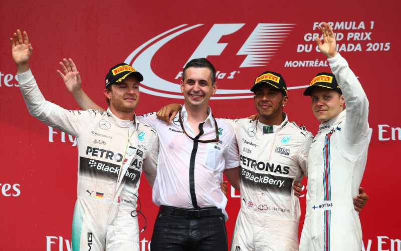 Race Winner Lewis Hamilton of Great Britain and Mercedes GP celebrates on the podium with second placed Nico Rosberg (L) of Germany and Mercedes GP and third placed Valtteri Bottas (R) of Finland and Williams during the Canadian Formula One Grand Prix at Circuit Gilles Villeneuve on June 7, 2015 in Montreal, Canada. 