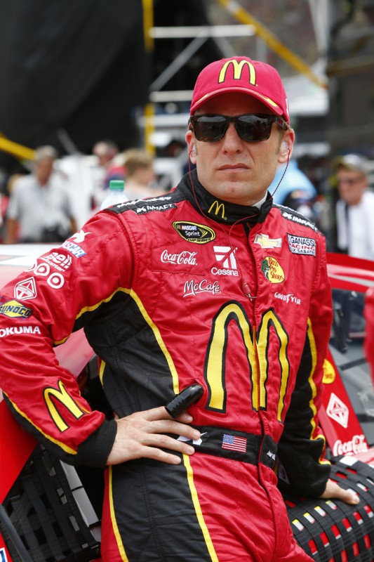 Jamie McMurray, driver of the #1 McDonald's Chevrolet, stands on the grid prior to the NASCAR Sprint Cup Series Quicken Loans 400 at Michigan International Speedway on June 14, 2015 in Brooklyn, Michigan. 