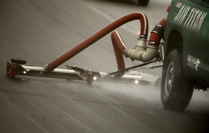 Air Titan 2.0 trucks work to dry the track during a rain delay at the NASCAR Sprint Cup Series Quicken Loans 400 at Michigan International Speedway on June 14, 2015 in Brooklyn, Michigan. 