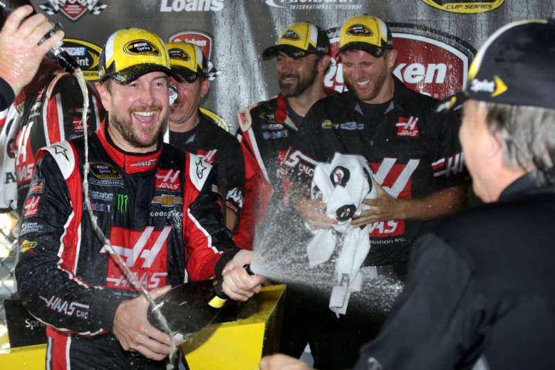 Kurt Busch, driver of the #41 Haas Automation Chevrolet, celebrates in an alternate victory lane after winning the NASCAR Sprint Cup Series Quicken Loans 400 at Michigan International Speedway on June 14, 2015 in Brooklyn, Michigan. 