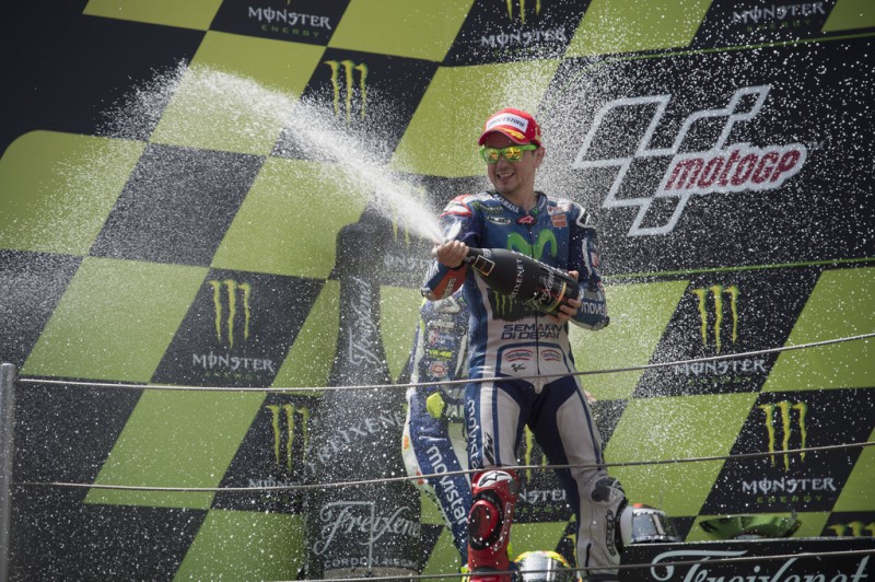 Jorge Lorenzo of Spain and Repsol Honda Team celebrates his victory with champagne on the podium at the end of the MotoGP race during the MotoGp of Catalunya at Circuit de Catalunya on June 14, 2015 in Montmelo, Spain. 