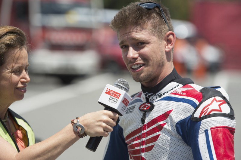 Casey Stoner of Australia speaks with a journalist before the MotoGP race during the MotoGp of Catalunya - Race at Circuit de Catalunya on June 14, 2015 in Montmelo, Spain. 