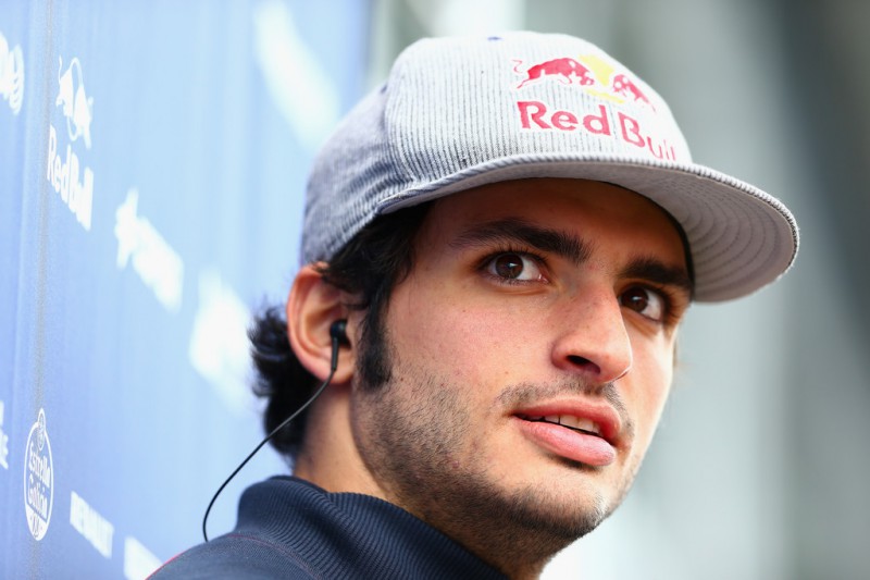 Carlos Sainz of Spain and Scuderia Toro Rosso looks on in the paddock before the Formula One Grand Prix of Austria at Red Bull Ring on June 21, 2015 in Spielberg, Austria. Carlos Sainz of Spain and Scuderia Toro Rosso looks on in the paddock before the Formula One Grand Prix of Austria at Red Bull Ring on June 21, 2015 in Spielberg, Austria.
