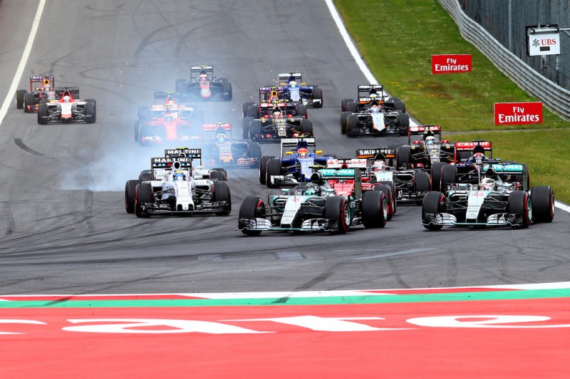 Nico Rosberg of Germany and Mercedes GP leads Lewis Hamilton of Great Britain and Mercedes GP and Sebastian Vettel of Germany and Ferrari into the first corner during the Formula One Grand Prix of Austria at Red Bull Ring on June 21, 2015 in Spielberg, Austria.