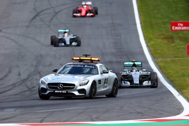 Nico Rosberg of Germany and Mercedes GP, Lewis Hamilton of Great Britain and Mercedes GP and Sebastian Vettel of Germany and Ferrari follow the safety car during the Formula One Grand Prix of Austria at Red Bull Ring on June 21, 2015 in Spielberg, Austria. 