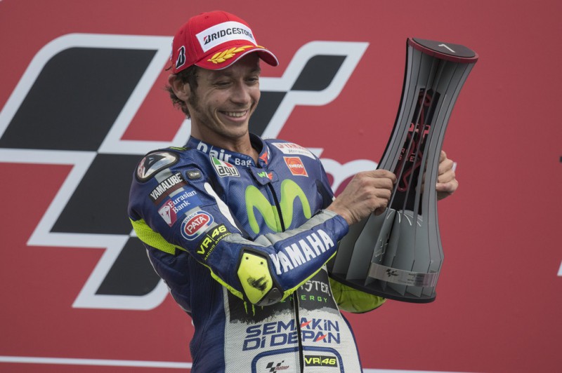 Valentino Rossi of Italy and Movistar Yamaha MotoGP celebrates the victory on the podium at the end of the MotoGP race during the MotoGP Netherlands - Race at on June 27, 2015 in Assen, Netherlands. Valentino Rossi of Italy and Movistar Yamaha MotoGP celebrates the victory on the podium at the end of the MotoGP race during the MotoGP Netherlands - Race at on June 27, 2015 in Assen, Netherlands.