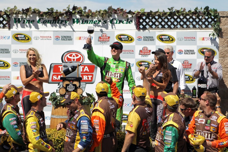 Kyle Busch, driver of the #18 M&M's Crispy Toyota, celebrates in Victory Lane after winning during the NASCAR Sprint Cup Series Toyota/Save Mart 350 at Sonoma Raceway on June 28, 2015 in Sonoma, California. 