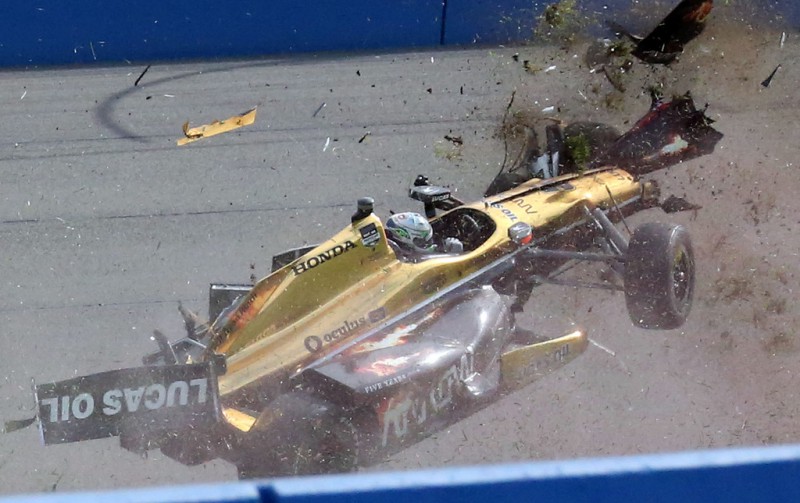 Race car driver Ryan Briscoe crashes during the Indy Car MAVTV 500 race at the Auto Club Speedway on June 27, 2015 in Fontana, California. Race car driver Ryan Briscoe crashes during the Indy Car MAVTV 500 race at the Auto Club Speedway on June 27, 2015 in Fontana, California.