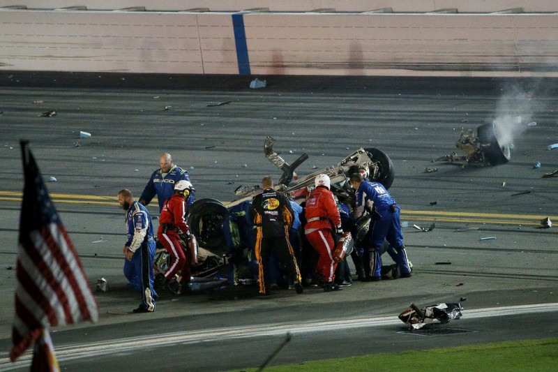 Austin Dillon, driver of the #3 Bass Pro Shops Chevrolet, receives medical attention after a crash following the checkered flag during the NASCAR Sprint Cup Series Coke Zero 400 Powered by Coca-Cola at Daytona International Speedway on July 6, 2015 in Daytona Beach, Florida. Austin Dillon, driver of the #3 Bass Pro Shops Chevrolet, receives medical attention after a crash following the checkered flag during the NASCAR Sprint Cup Series Coke Zero 400 Powered by Coca-Cola at Daytona International Speedway on July 6, 2015 in Daytona Beach, Florida.