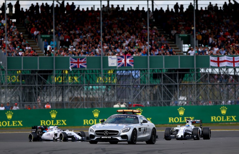 The safety car drives ahead of Felipe Massa of Brazil and Williams and Valtteri Bottas of Finland and Williams during the Formula One Grand Prix of Great Britain at Silverstone Circuit on July 5, 2015 in Northampton, England. The safety car drives ahead of Felipe Massa of Brazil and Williams and Valtteri Bottas of Finland and Williams during the Formula One Grand Prix of Great Britain at Silverstone Circuit on July 5, 2015 in Northampton, England.