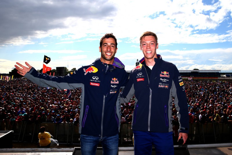 Daniel Ricciardo of Australia and Infiniti Red Bull Racing and Daniil Kvyat of Russia and Infiniti Red Bull Racing pose on stage after the Formula One Grand Prix of Great Britain at Silverstone Circuit on July 5, 2015 in Northampton, England. 