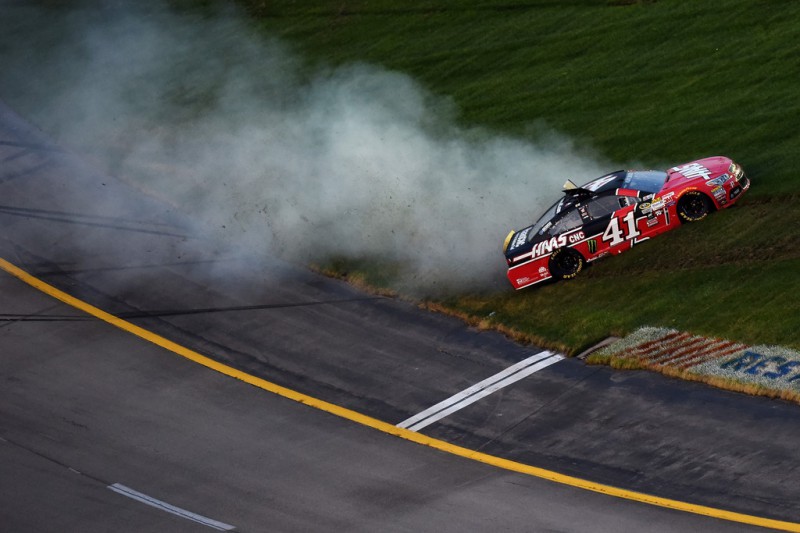 Kurt Busch, driver of the #41 Haas Automation Chevrolet, spins through the infield grass during the NASCAR Sprint Cup Series Quaker State 400 presented by Advance Auto Parts at Kentucky Speedway on July 11, 2015 in Sparta, Kentucky. 