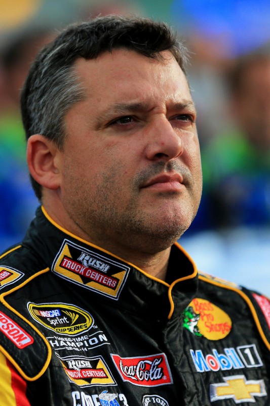 Tony Stewart, driver of the #14 Rush Truck Centers Chevrolet, takes part in pre-race ceremonies for the NASCAR Sprint Cup Series Quaker State 400 presented by Advance Auto Parts at Kentucky Speedway on July 11, 2015 in Sparta, Kentucky. 