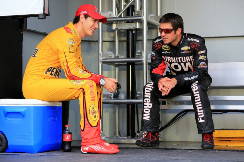 Joey Logano, driver of the #22 Shell Pennzoil/AutoTrader Ford, and Martin Truex Jr., driver of the #78 Furniture Row/Visser Precision Chevrolet, take part in pre-race ceremonies for the NASCAR Sprint Cup Series Quaker State 400 presented by Advance Auto Parts at Kentucky Speedway on July 11, 2015 in Sparta, Kentucky. Joey Logano, driver of the #22 Shell Pennzoil/AutoTrader Ford, and Martin Truex Jr., driver of the #78 Furniture Row/Visser Precision Chevrolet, take part in pre-race ceremonies for the NASCAR Sprint Cup Series Quaker State 400 presented by Advance Auto Parts at Kentucky Speedway on July 11, 2015 in Sparta, Kentucky.