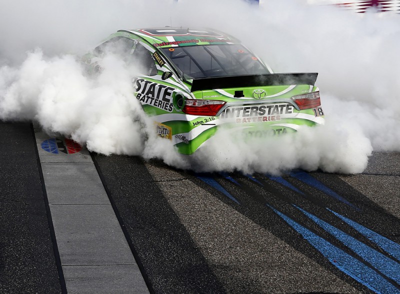 Kyle Busch, driver of the #18 Interstate Batteries Toyota, celebrates with a burnout after winning the NASCAR Sprint Cup Series 5-Hour ENERGY 301 at New Hampshire Motor Speedway on July 19, 2015 in Loudon, New Hampshire. Kyle Busch, driver of the #18 Interstate Batteries Toyota, celebrates with a burnout after winning the NASCAR Sprint Cup Series 5-Hour ENERGY 301 at New Hampshire Motor Speedway on July 19, 2015 in Loudon, New Hampshire.