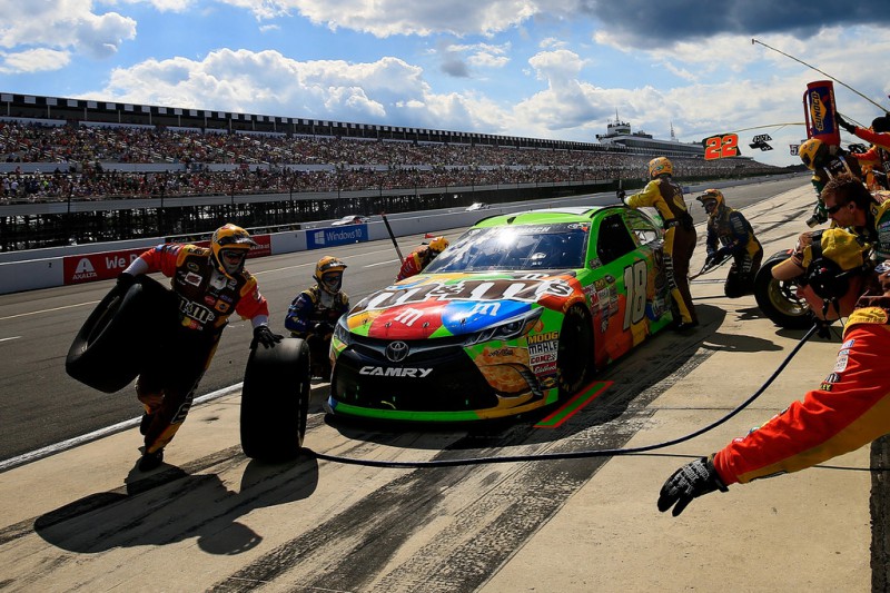 Kyle Busch, driver of the #18 M&M's Crispy Toyota, pits during the NASCAR Sprint Cup Series Windows 10 400 at Pocono Raceway on August 2, 2015 in Long Pond, Pennsylvania. 