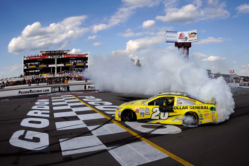 Matt Kenseth, driver of the #20 Dollar General Toyota, celebrates with a burnout after winning the NASCAR Sprint Cup Series Windows 10 400 at Pocono Raceway on August 2, 2015 in Long Pond, Pennsylvania. 