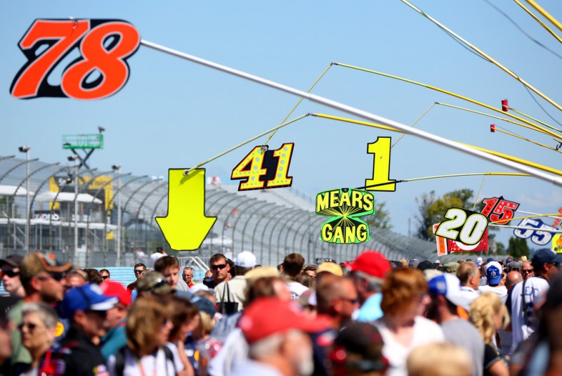 Fans walk on pit road prior to the NASCAR Sprint Cup Series Cheez-It 355 at the Glen at Watkins Glen International on August 9, 2015 in Watkins Glen, New York. Fans walk on pit road prior to the NASCAR Sprint Cup Series Cheez-It 355 at the Glen at Watkins Glen International on August 9, 2015 in Watkins Glen, New York.