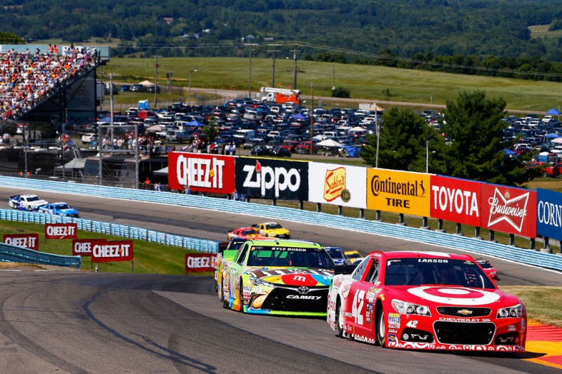 Kyle Larson, driver of the #42 Target Chevrolet, leads a pack of cars during the NASCAR Sprint Cup Series Cheez-It 355 at the Glen at Watkins Glen International on August 9, 2015 in Watkins Glen, New York. Kyle Larson, driver of the #42 Target Chevrolet, leads a pack of cars during the NASCAR Sprint Cup Series Cheez-It 355 at the Glen at Watkins Glen International on August 9, 2015 in Watkins Glen, New York.