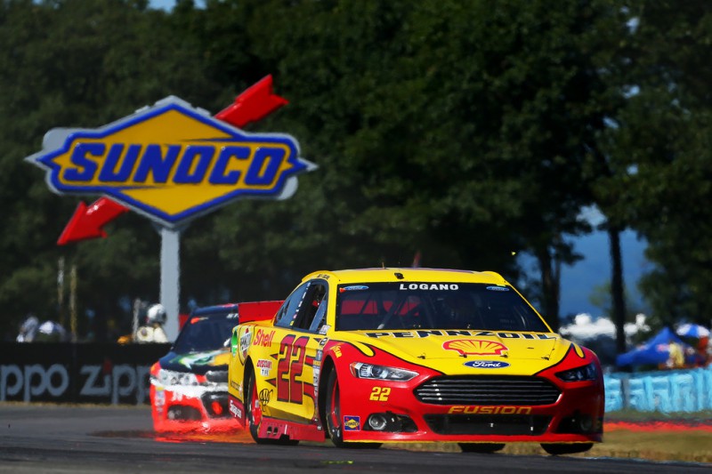 Joey Logano, driver of the #22 Shell Pennzoil Ford, leads a pack of cars during the NASCAR Sprint Cup Series Cheez-It 355 at the Glen at Watkins Glen International on August 9, 2015 in Watkins Glen, New York. Joey Logano, driver of the #22 Shell Pennzoil Ford, leads a pack of cars during the NASCAR Sprint Cup Series Cheez-It 355 at the Glen at Watkins Glen International on August 9, 2015 in Watkins Glen, New York.