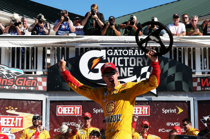 Joey Logano, driver of the #22 Shell Pennzoil Ford, celebrates in victory lane after winning the NASCAR Sprint Cup Series Cheez-It 355 at the Glen at Watkins Glen International on August 9, 2015 in Watkins Glen, New York. Joey Logano, driver of the #22 Shell Pennzoil Ford, celebrates in victory lane after winning the NASCAR Sprint Cup Series Cheez-It 355 at the Glen at Watkins Glen International on August 9, 2015 in Watkins Glen, New York.