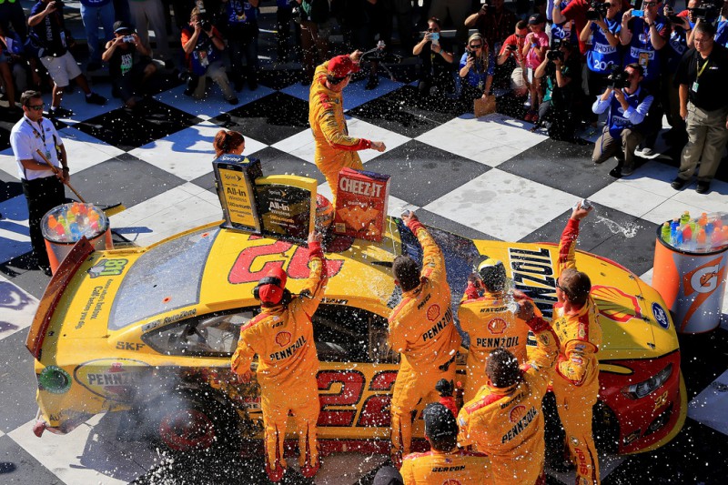 Joey Logano, driver of the #22 Shell Pennzoil Ford, celebrates in victory lane after winning the NASCAR Sprint Cup Series Cheez-It 355 at the Glen at Watkins Glen International on August 9, 2015 in Watkins Glen, New York. Joey Logano, driver of the #22 Shell Pennzoil Ford, celebrates in victory lane after winning the NASCAR Sprint Cup Series Cheez-It 355 at the Glen at Watkins Glen International on August 9, 2015 in Watkins Glen, New York.