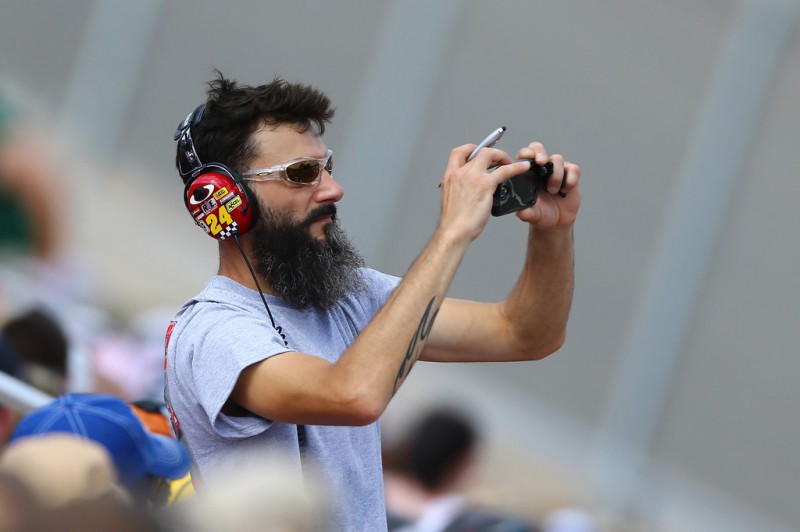 A race fan enjoys the action during the NASCAR Sprint Cup Series Pure Michigan 400 at Michigan International Speedway on August 16, 2015 in Brooklyn, Michigan. A race fan enjoys the action during the NASCAR Sprint Cup Series Pure Michigan 400 at Michigan International Speedway on August 16, 2015 in Brooklyn, Michigan.