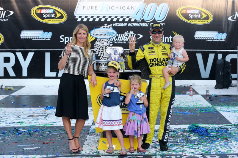 Matt Kenseth, driver of the #20 Dollar General Toyota, poses in victory lane with his wife Katie and daughters Kaylin, Grace, and Clara after winning the NASCAR Sprint Cup Series Pure Michigan 400 at Michigan International Speedway on August 16, 2015 in Brooklyn, Michigan. Matt Kenseth, driver of the #20 Dollar General Toyota, poses in victory lane with his wife Katie and daughters Kaylin, Grace, and Clara after winning the NASCAR Sprint Cup Series Pure Michigan 400 at Michigan International Speedway on August 16, 2015 in Brooklyn, Michigan.
