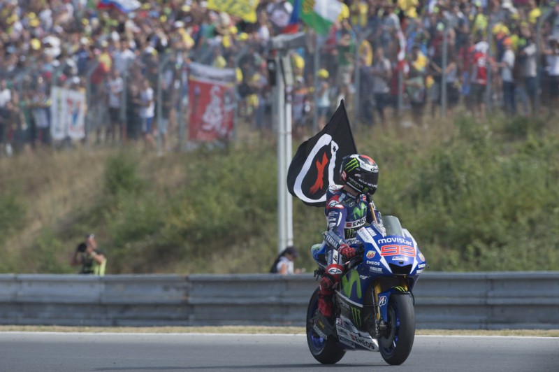 Jorge Lorenzo of Spain and Movistar Yamaha MotoGP celebrates the victory with flag at the end of the MotoGP race during the MotoGp of Czech Republic - Race at Brno Circuit on August 16, 2015 in Brno, Czech Republic. Jorge Lorenzo of Spain and Movistar Yamaha MotoGP celebrates the victory with flag at the end of the MotoGP race during the MotoGp of Czech Republic - Race at Brno Circuit on August 16, 2015 in Brno, Czech Republic.