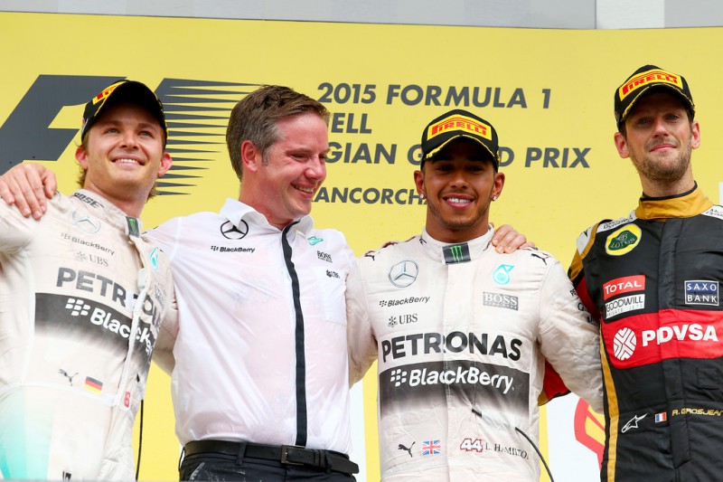 Lewis Hamilton of Great Britain and Mercedes GP celebrates on the podium next to Nico Rosberg of Germany and Mercedes GP and Romain Grosjean of France and Lotus after winning the Formula One Grand Prix of Belgium at Circuit de Spa-Francorchamps on August 23, 2015 in Spa, Belgium. Lewis Hamilton of Great Britain and Mercedes GP celebrates on the podium next to Nico Rosberg of Germany and Mercedes GP and Romain Grosjean of France and Lotus after winning the Formula One Grand Prix of Belgium at Circuit de Spa-Francorchamps on August 23, 2015 in Spa, Belgium.