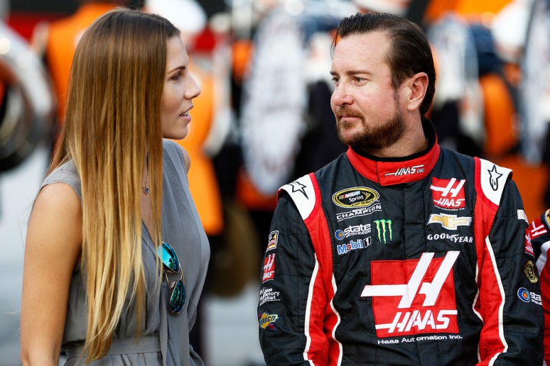 Kurt Busch, driver of the #41 Haas Automation Chevrolet, talks to his girlfriend, Ashley Van Metre, prior to the NASCAR Sprint Cup Series IRWIN Tools Night Race at Bristol Motor Speedway on August 22, 2015 in Bristol, Tennessee. 