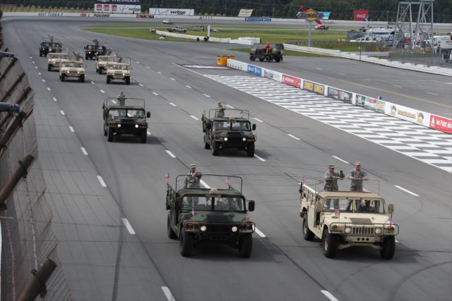 The Pennsylvania National Guardsmen take a parade lap on the frontstretch during pre-race festivities for the ABC Supply 500 at Pocono Raceway
