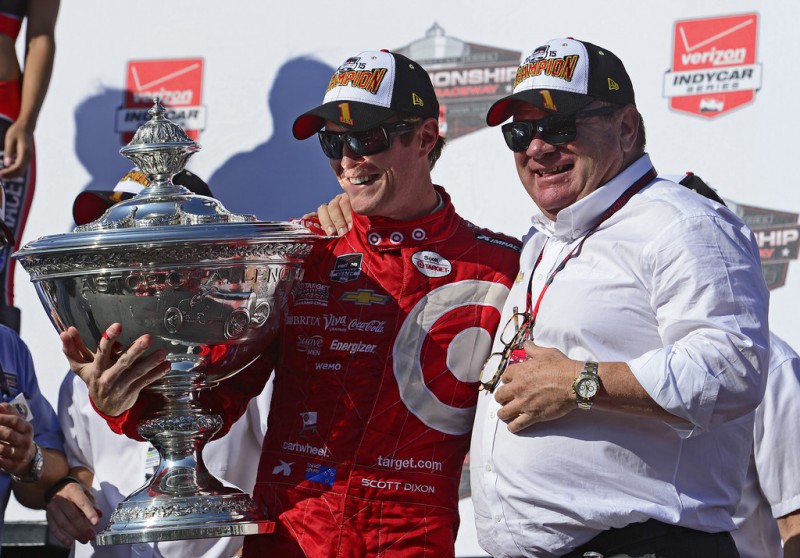 Scott Dixon of New Zealand driver of the #9 Target Chip Ganassi Racing Chevrolet Dallara and team owner Chip Ganassi pose with the Championship Trophy presentation stage after winning the Verizon IndyCar Series GoPro Grand Prix of Sonoma at Sonoma Raceway on August 30, 2015 in Sonoma, California. 