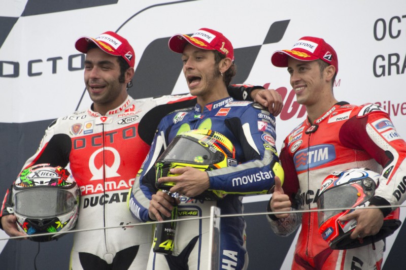 (L-R) Danilo Petrucci of Italy and Pramac Racing, Valentino Rossi of Italy and Movistar Yamaha MotoGP, Andrea Dovizioso of Italy and Ducati Team pose on the podium at the end of the MotoGP race during the MotoGp Of Great Britain - Race at Silverstone Circuit on August 30, 2015 in Northampton, United Kingdom. 