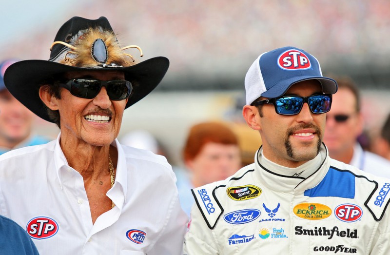 Aric Almirola, driver of the #43 STP Ford, right, and team owner Richard Petty take part in pre-race ceremonies for the NASCAR Sprint Cup Series Bojangles' Southern 500 at Darlington Raceway on September 6, 2015 in Darlington, South Carolina. 
